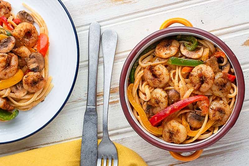 Pasta, shrimp and vegetables cooked with Cajun seasoning