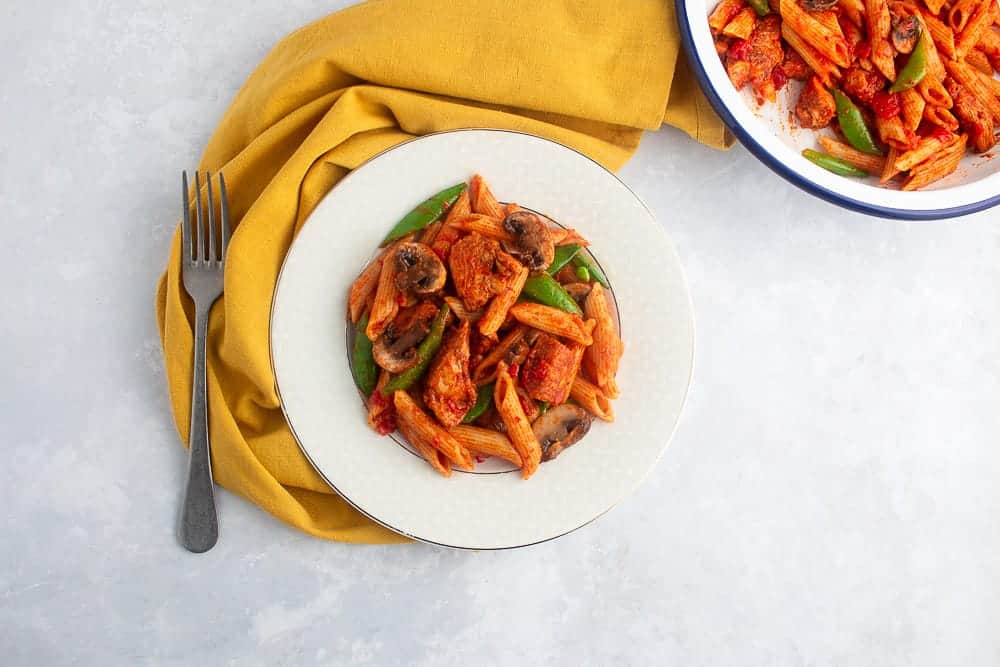 Beautiful image of pasta chicken dish cooked with berbere spices.