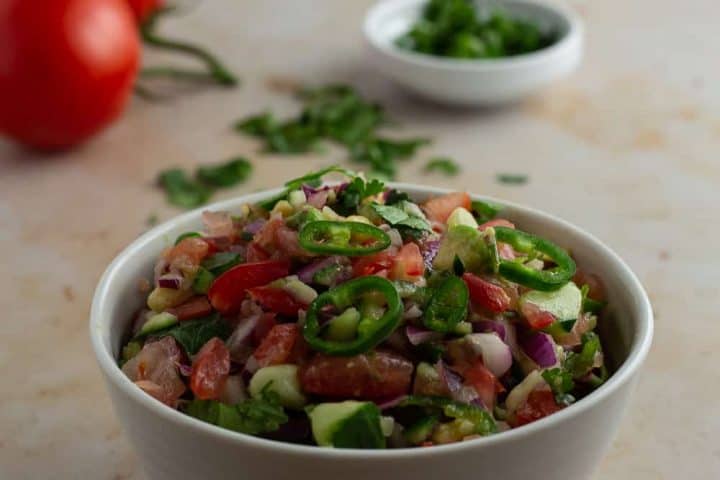 Kachumbari Kenyan tomato and onion salad on a bowl