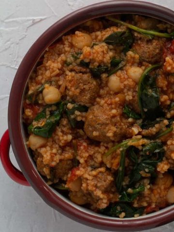 Ethiopian meatballs with berbere spices cooked in a tomato sauces with couscous, chickpeas and spinach