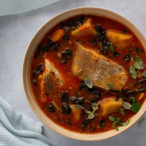Cocoyam soup prepared with cocoyam, fish and kale in a bowl