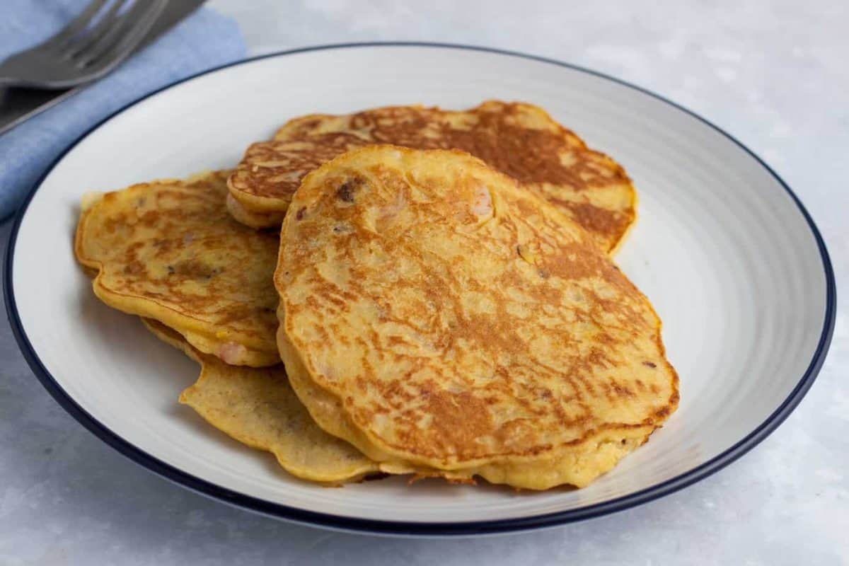 Plantain pancakes with prawns on a plate