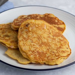 Plantain pancakes with prawns on a plate