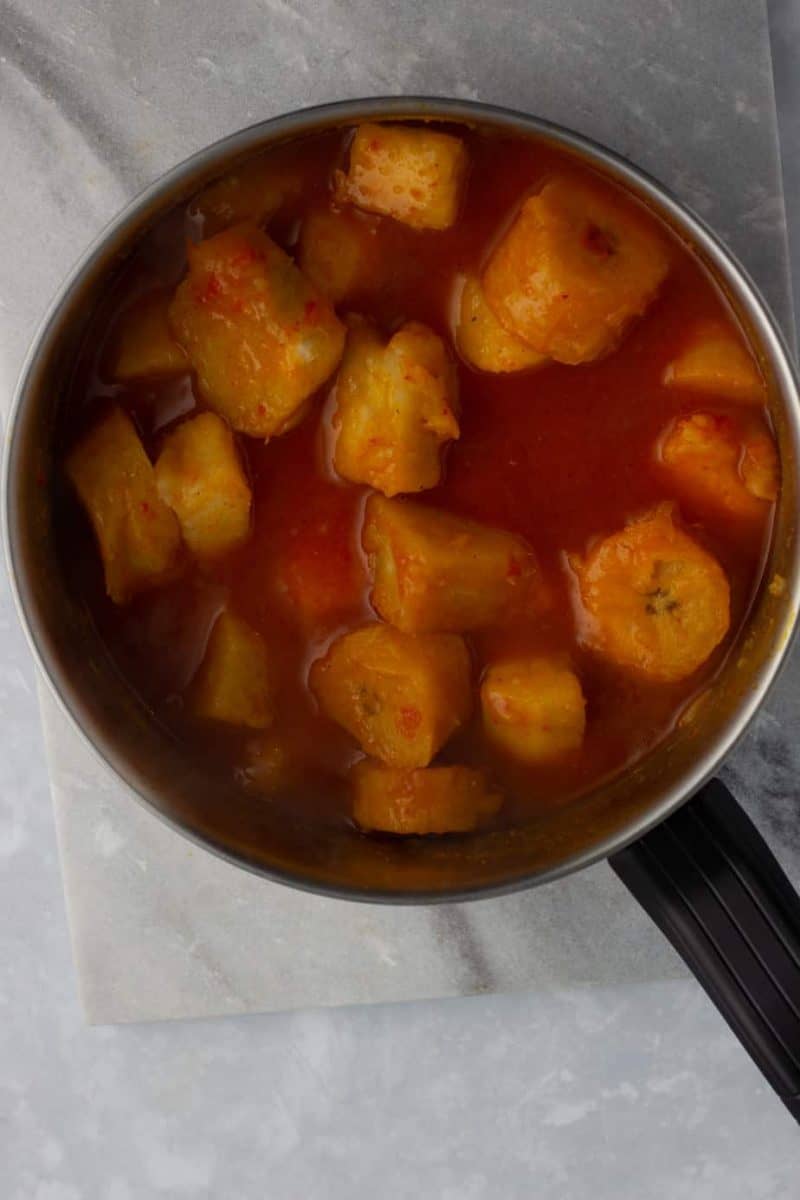 Yam porridge with plantain on a pot