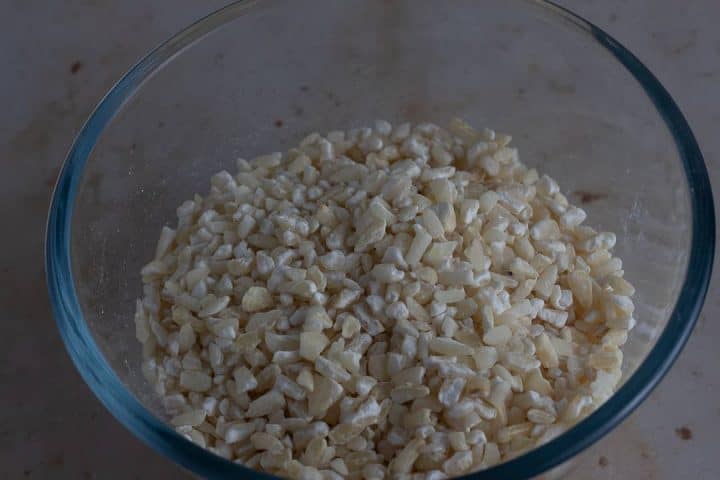 Hominy corn in a bowl to make ogi/akamu