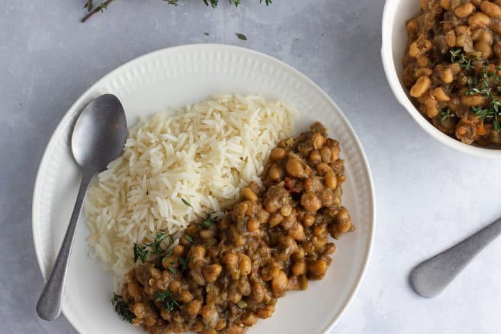 Caribbean curried beans with rice on a white plate