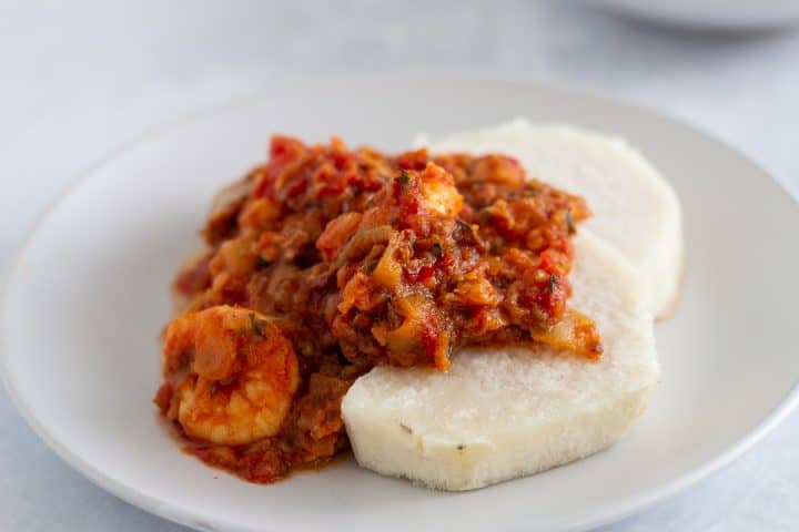 African garden egg stew served with yam in a bowl
