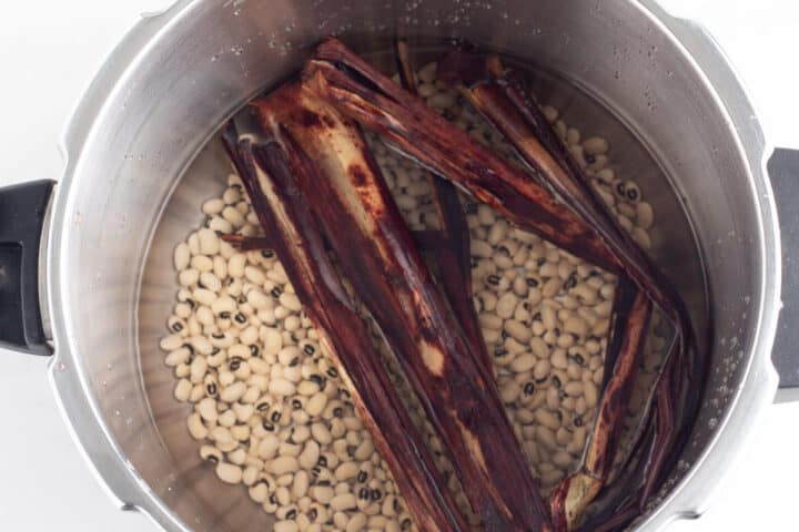 Beans and waakye leaves in a pot