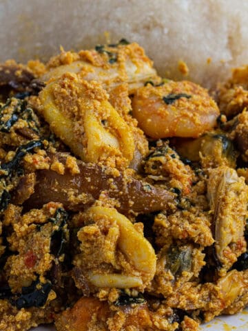 Nigerian egusi soup with eba close up image