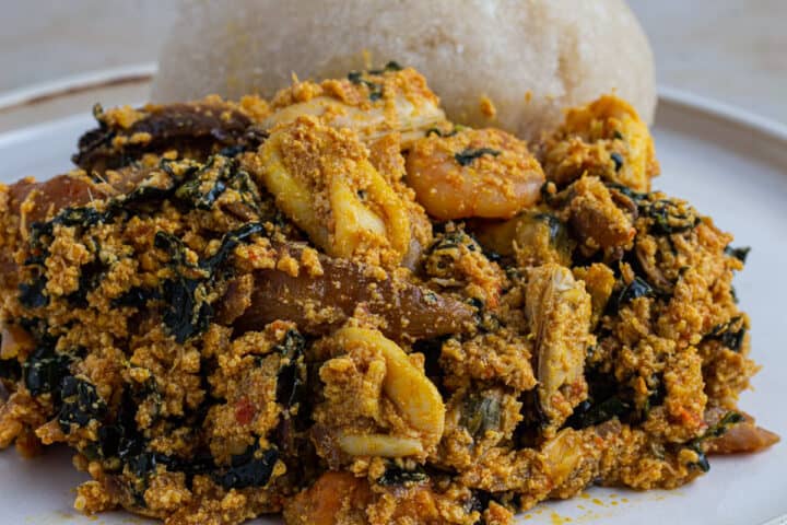 Nigerian egusi soup with eba close up image