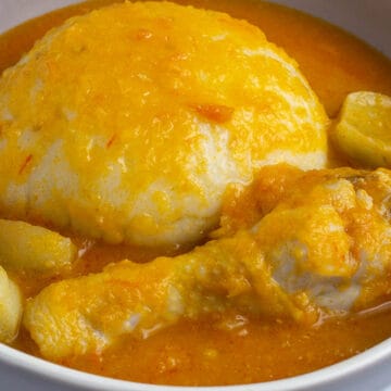 Ghana Light Soup with chicken in a bowl served with fufu