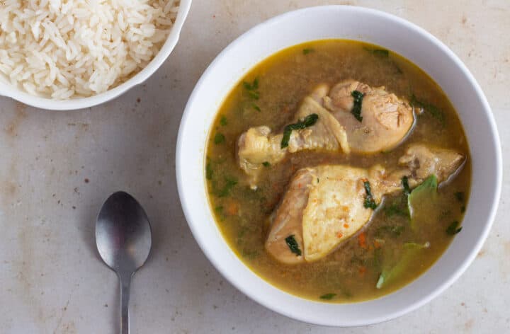 Nigerian chicken pepper soup served with rice