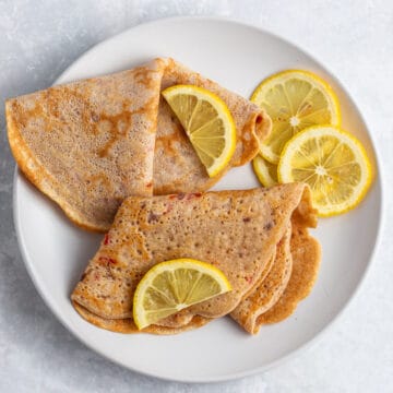 Nigerian pancakes with lemon garnish