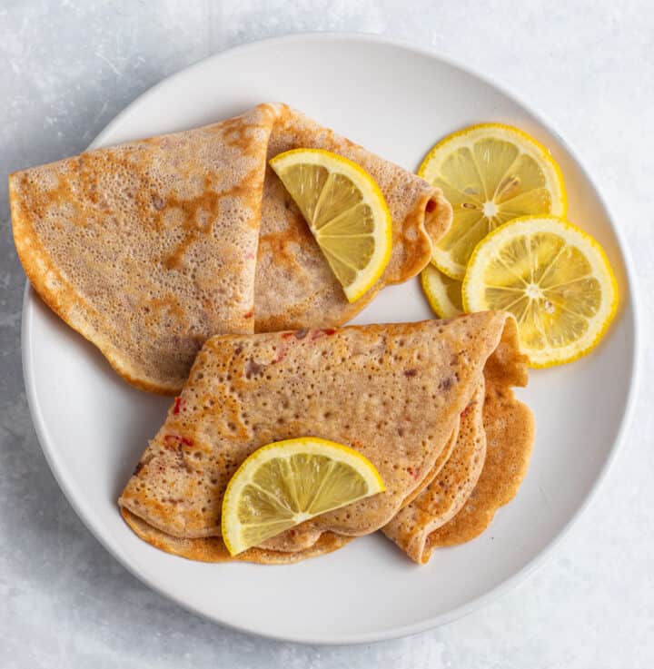 Nigerian pancakes with lemon garnish