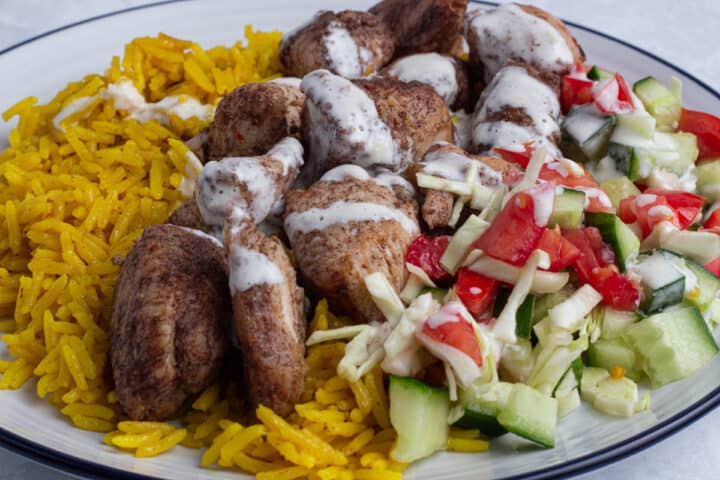 Chicken shawarma - Yellow rice, chicken shawarma and salad in a bowl
