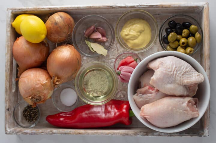 Ingredients for chicken yassa on a tray