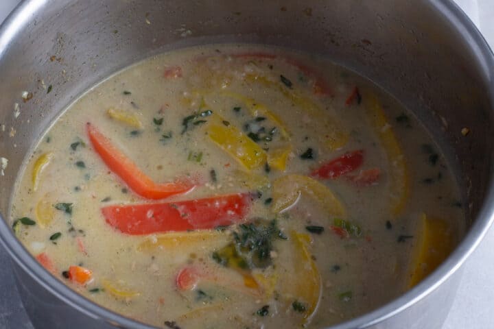 Jerk chicken pasta cooking in a pot