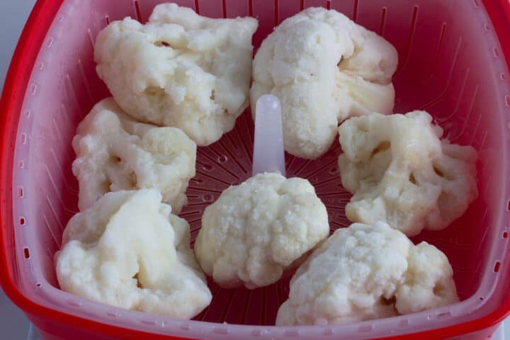 Frozen cauliflower in a microwave steamer