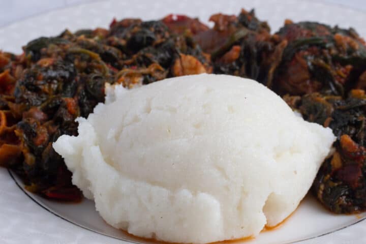 Sadza (Ugali) - served with spinach stew and meat on a plate